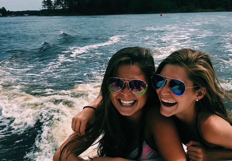 two young girls on boat laughing