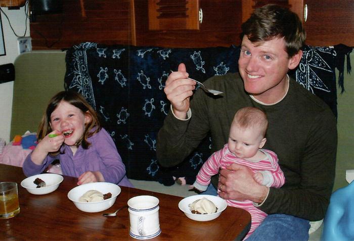 Family enjoying ice cream onboard boat